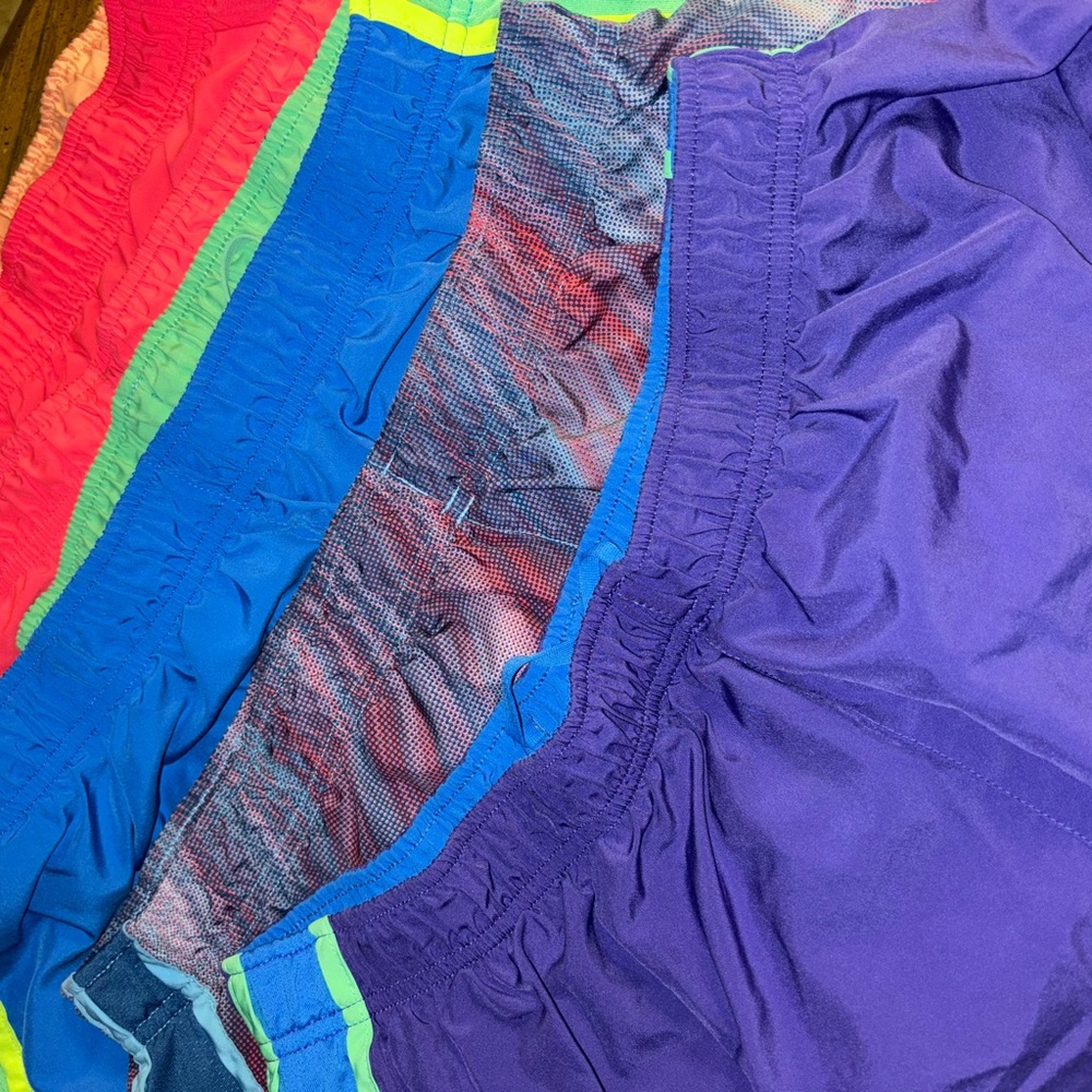 FIVE PAIRS of NIKE XL Running shorts. Dri fit with inside bottom as well.